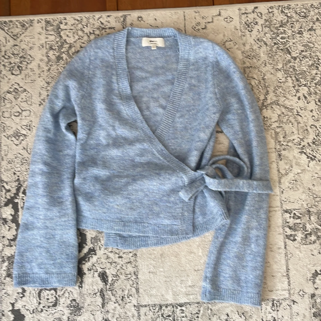 Ljusblå omlottkofta från Gina Tricot