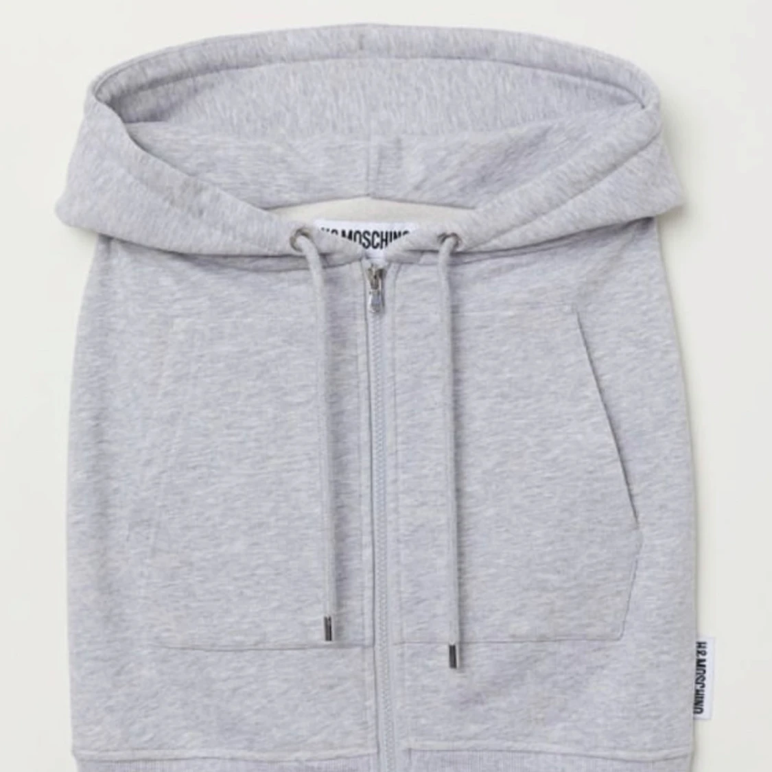 Grå kjol med dragkedja från Moschino x HM kollektionen