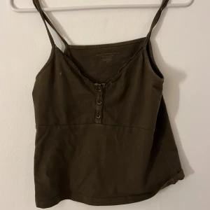 Mörkbrunt linne - Snygg mörkbrunt linne från brandy