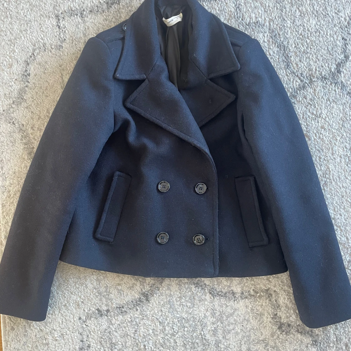 Marinblå skepparkavaj