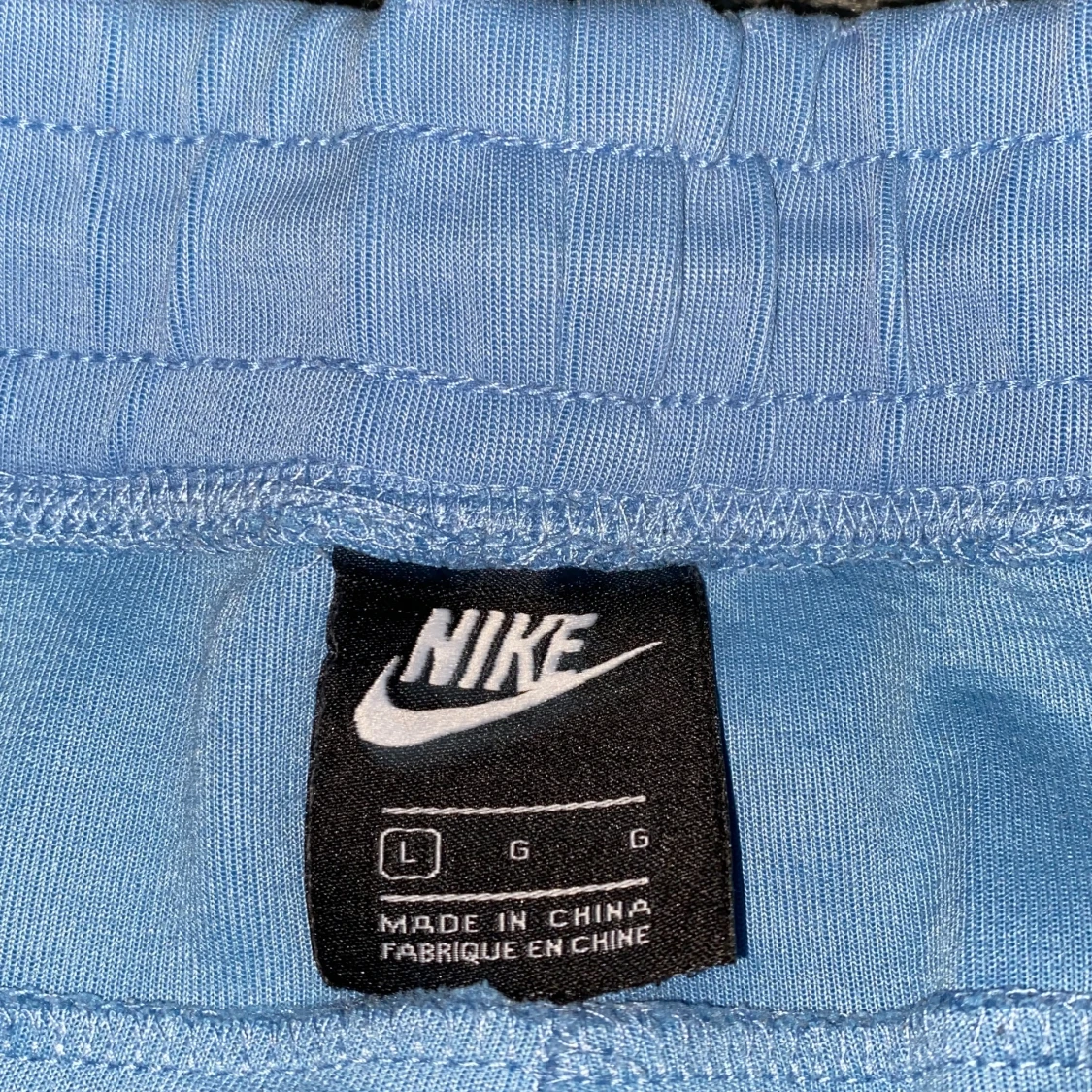 Nike ljusblå mjukisbyxor med snörning - 2