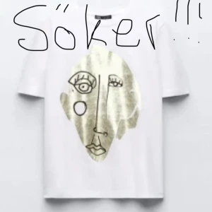 Vit t-shirt med guldtryck ansikte - Söker denna tröja från Zara i storlek S eller Xs!