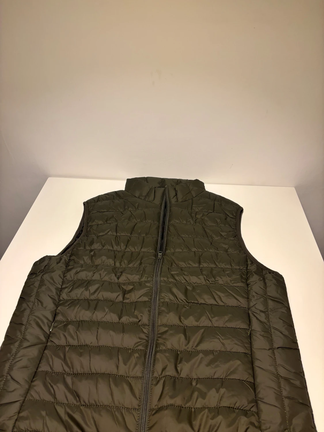Mörkgrön quiltad dunväst