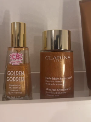Shimmer Oil jätte bra pris!! - Jättefin skimmrig kropps olja från Clarins. Säljer då den inte kommer till användning. Innehåller små fina guldpigment (som ger lyster och skimmer) Nypris: 629