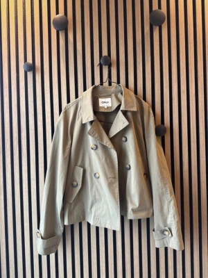 Trenchcoat  - Använder ej