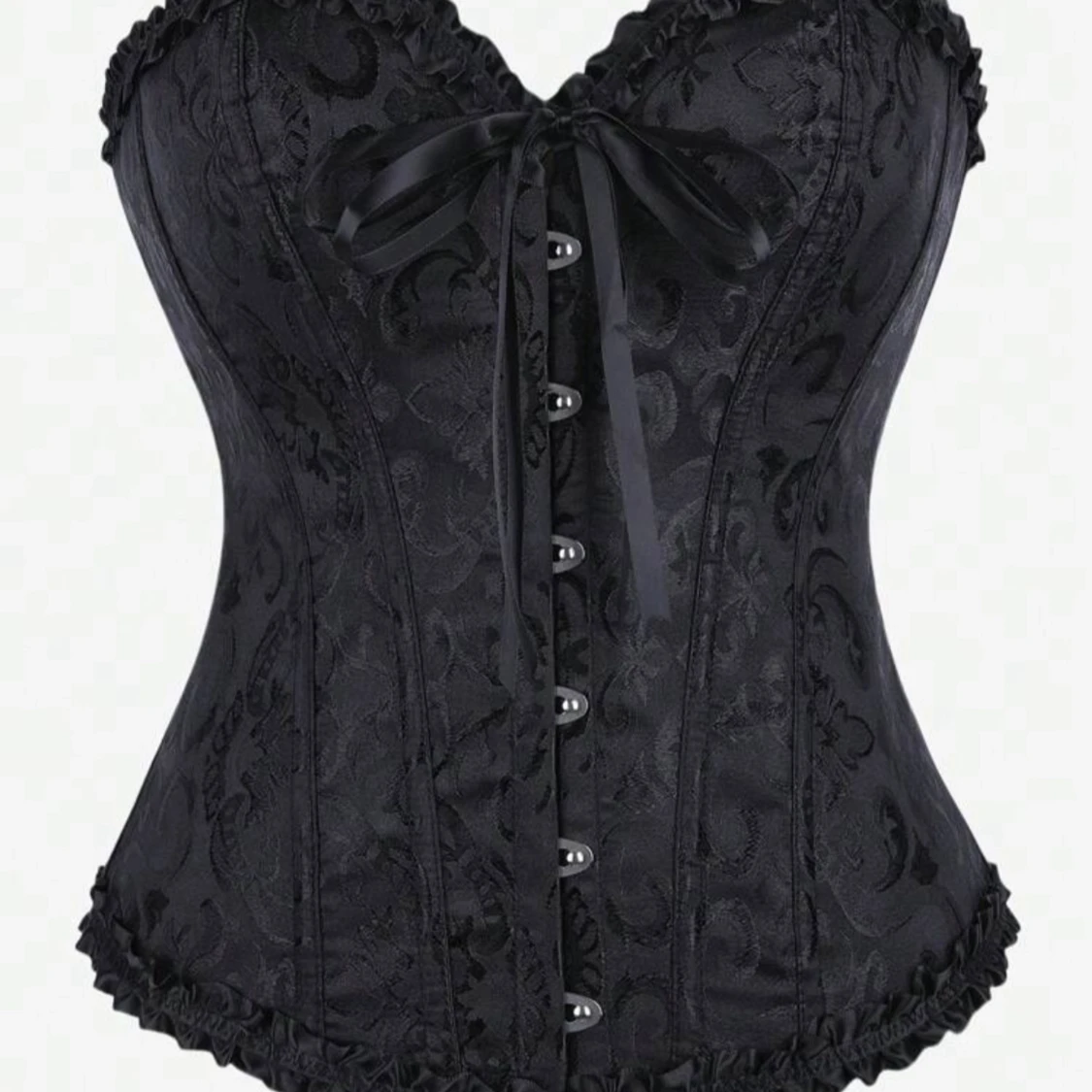 Svart korsett med snörning och rosett
