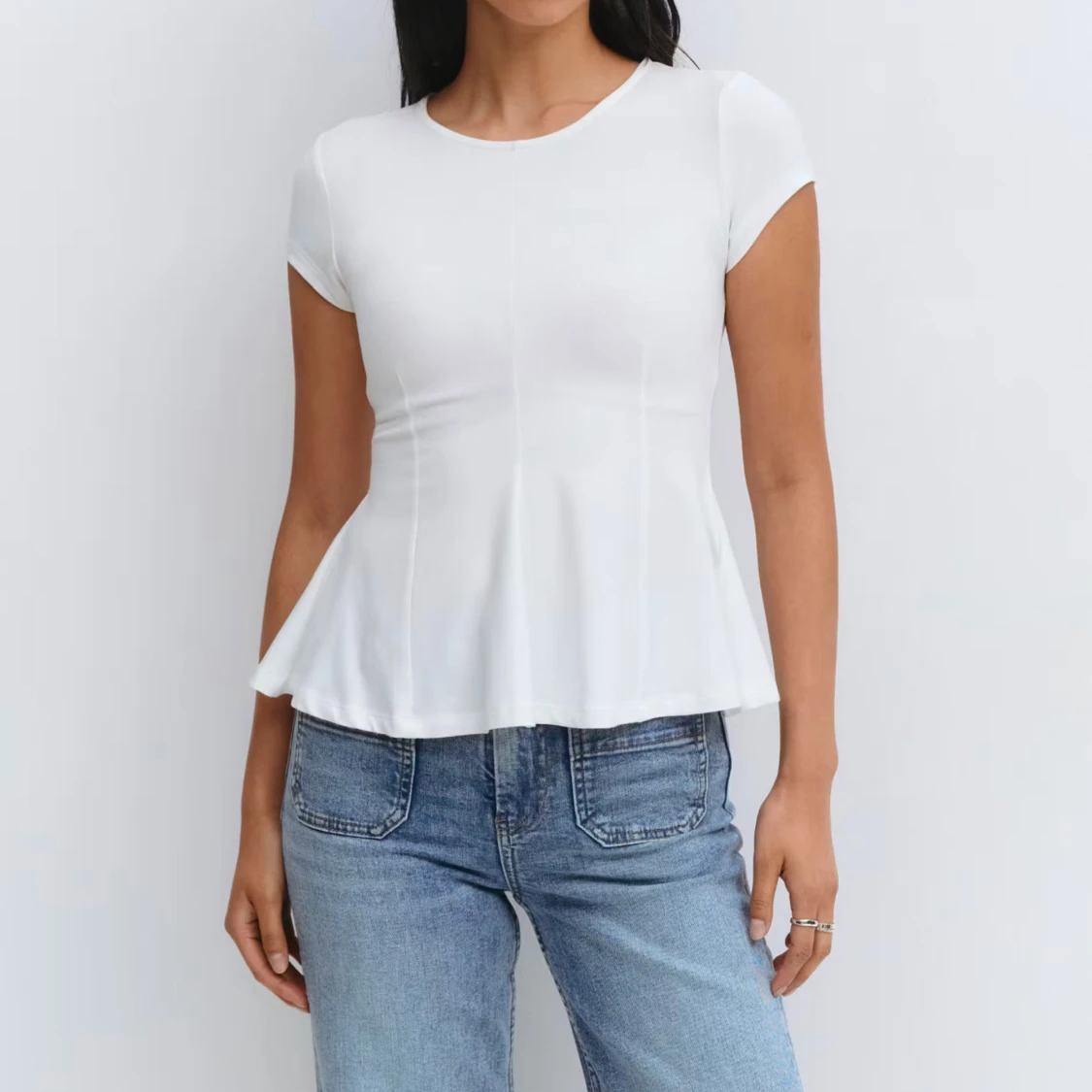 Vit peplum topp från Gina Tricot