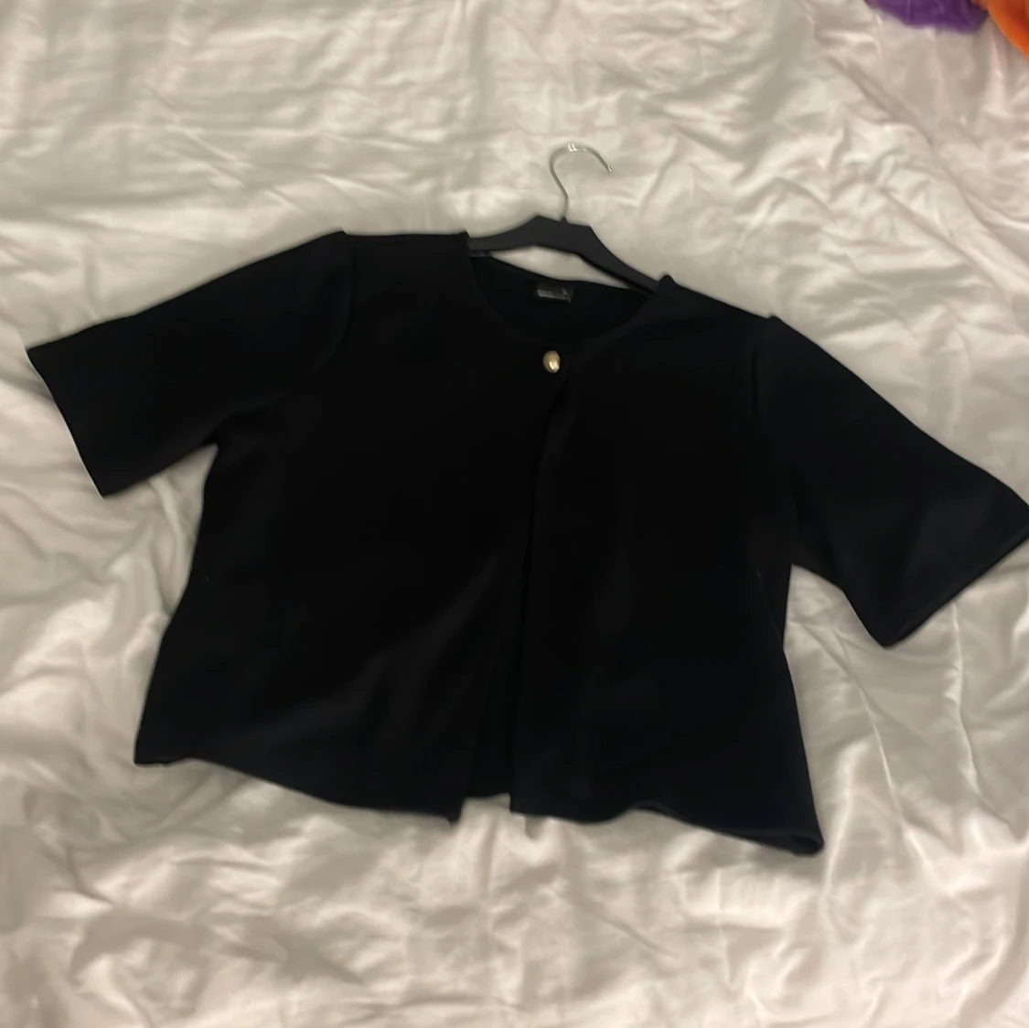 Svart bolerotopp från Gina Tricot