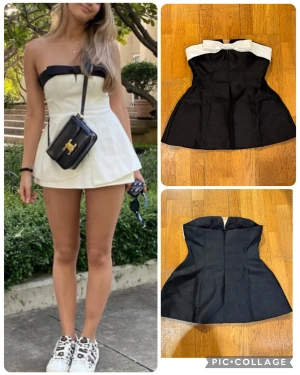 Svartvit kort klänning med rosett M - Supersöt kort klänning i svart och vitt med axelbandslös design och en stor vit rosett upptill. Klänningen har en markerad midja och utsvängd kjol, vilket ger en chic och ungdomlig siluett. Materialet är stadigt och håller formen snyggt. Perfekt för dig som vill sticka ut med en elegant look.