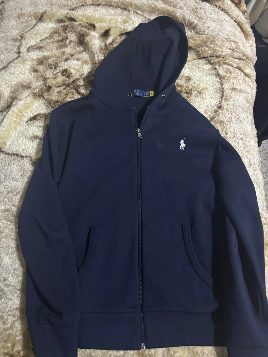 En mörkblå Ralph lauren zip.  