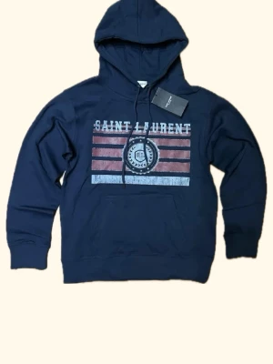 Saint Laurent hoodie - Riktigt snygg saint Laurent hoodie köpt för länge sen men aldrig använd passar m