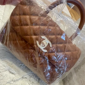 Väska - Brun Chanel väska, inget fel på den. Aldrig använt.