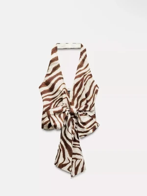 Zebramönstrad halterneck topp -  zebramönstrad halterneck topp med stor knytning framtill. Använt 2-3 gånger så jätte fint skick!