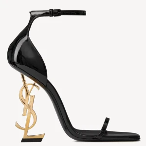 Saint Laurent klackar - Ikoniska Saint Laurent Opyum klackar i svart skinn med hög klack formad som YSL-loggan i guld metall. Dessa klackar finns storlekar 34-41. De är i 11cm klackhöjd. Varför dessa säljs är pågrund av utförsäljning av lager.