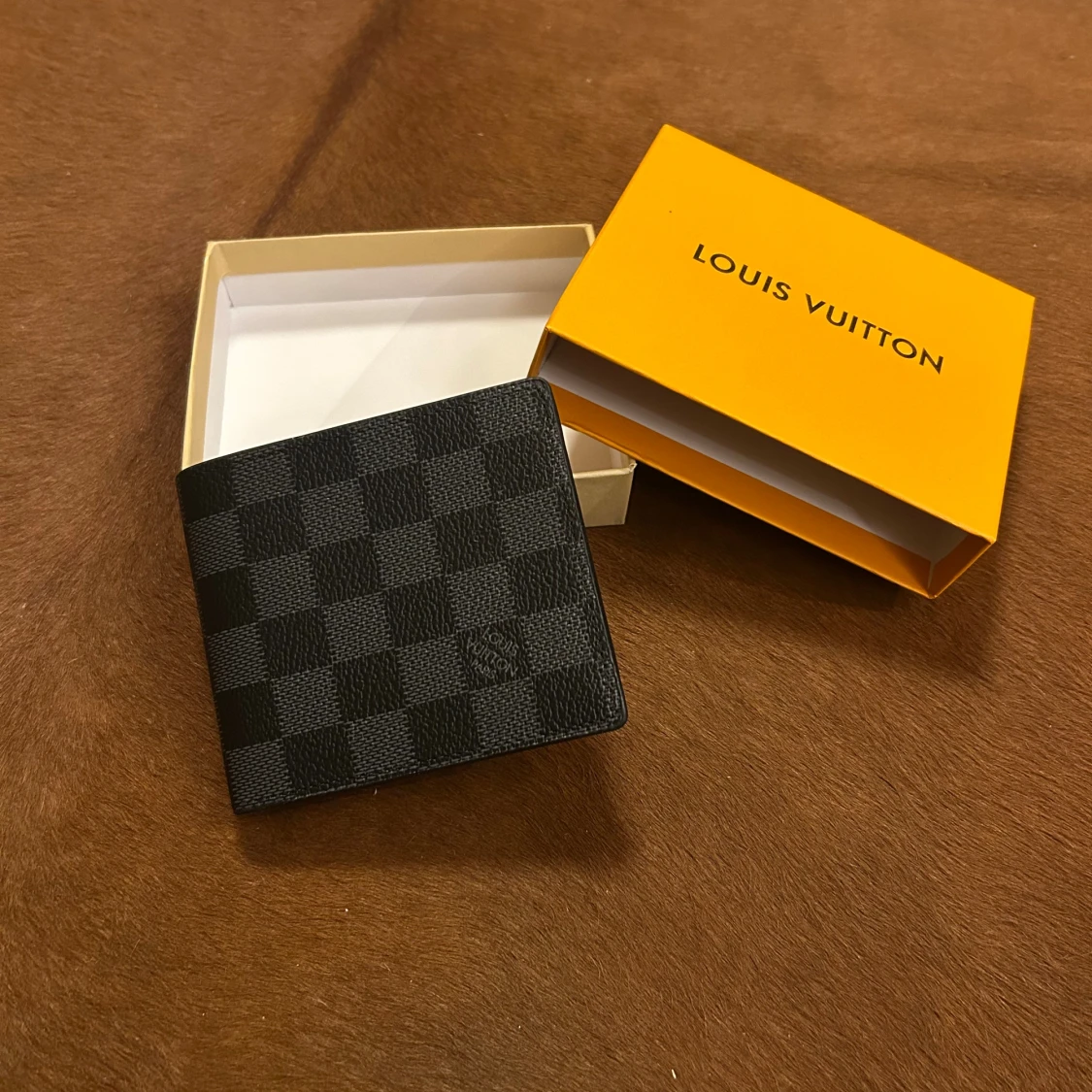 Svart Louis Vuitton plånbok i skinn