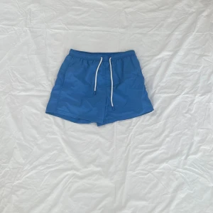 Badshorts - Blå badshorts Zara.