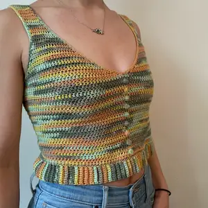 handmade tank top with fabric buttons and ribbing, crocheted with 100% fine cotton yarn. well-fitting and made free-handed. unique design, a perfect simple staple. multicolored: green💚, yellow💛, and orange🧡