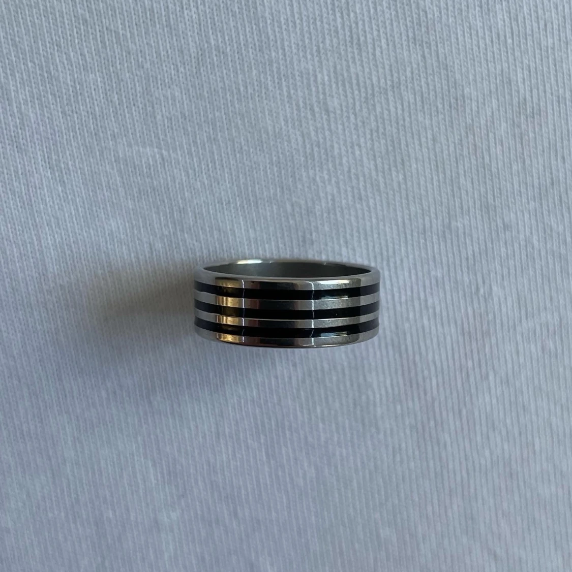 Black and silver striped ring