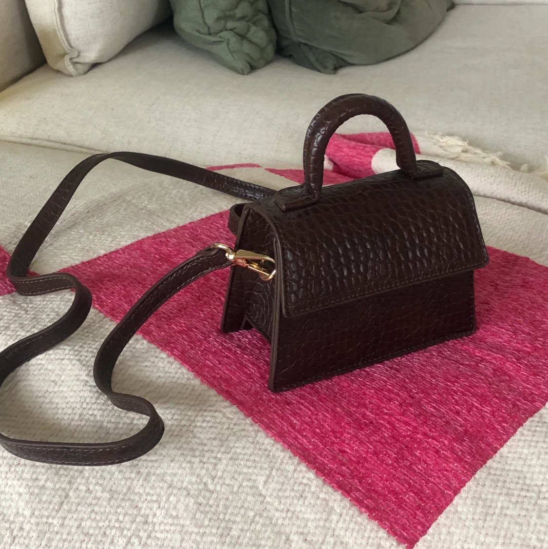 Liten brun handvĂ€ska đ€