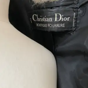 Very rare, made by Christian Dior furriers mid 80s. Black cross Kohinoor mink with silk and leather details.  Size medium, 140cm long. Mint condition.