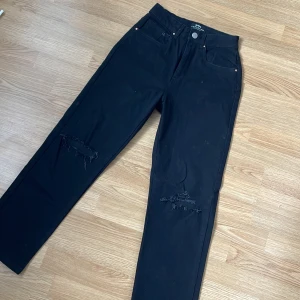 Black jeans  - Rips at the knees  High waist