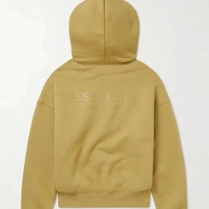 ESSENTIALS HOODIE - Fear of God Essentials hoodie. Storlek S. Använd 5-6 gånger. Tröjan är i en ”Senaps gul”