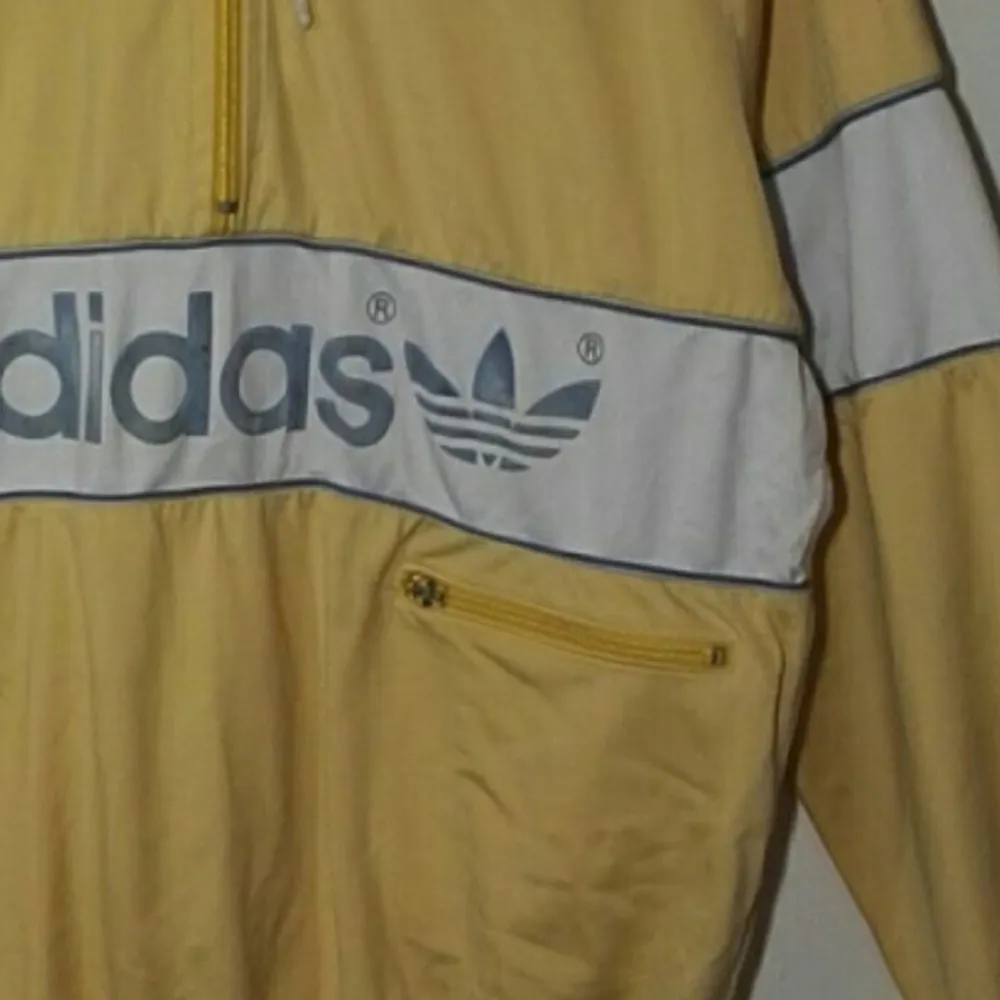 Incredibly stylish adidas original yellow hoodie. The size has been blotted out but guesses on size M.. Hoodies.