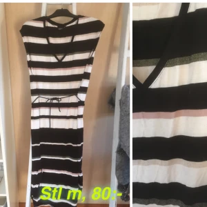  - Klänning, längre bak. Stl m