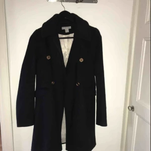  - Knee length navy blue jacket 
