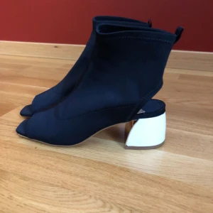  - Never worn, trendy; very comfortable 