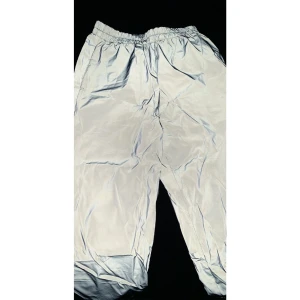Reflective trodsedes, size 34/36 - Reflective pants that glow in the dark.  Goes to the ankle and can fits a 34 / xs and 36 / s.  Nothing wrong.  Used once.