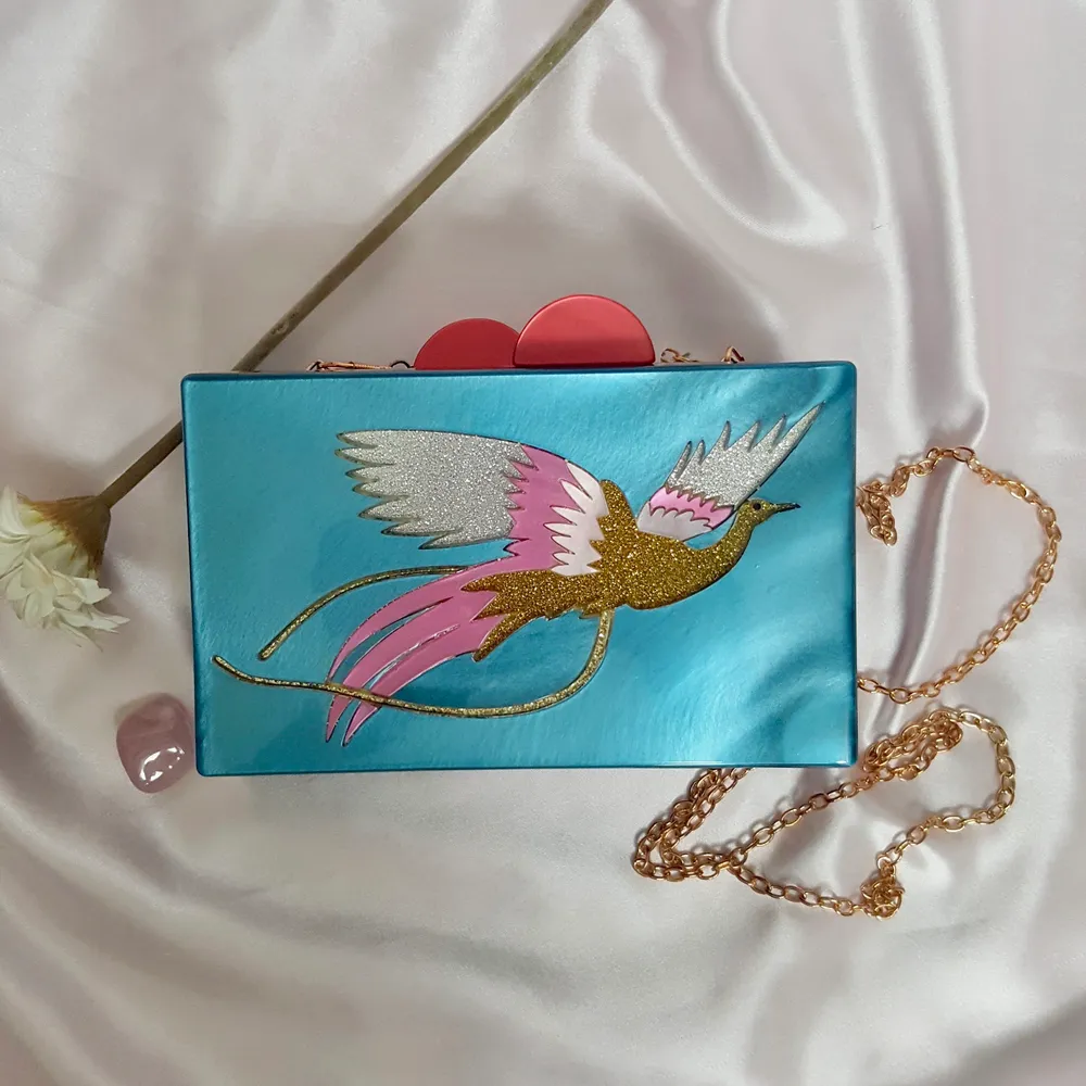 🌼 CUTE BOX SHAPE BLUE PAINTED BAG WITH GOLD BIRD AND PINK DETAILS WITH A GOLD CHAIN STRAP (CAN BE TAKEN OFF TO USE BAG AS CLUTCH). BOUGHT IN LONDON.  ▪Condition 10/10  🌻My measurements ▪Height 161cm / 5'3