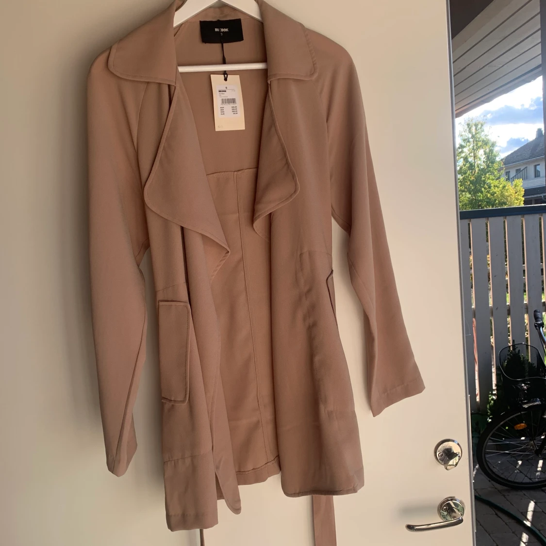 Tunn beigh kappa storlek S