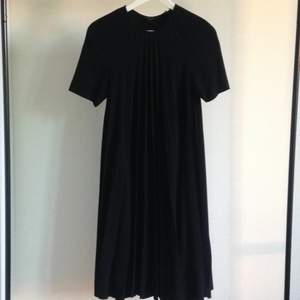 Black free-cut COS dress. Very comfortable, but classy.
