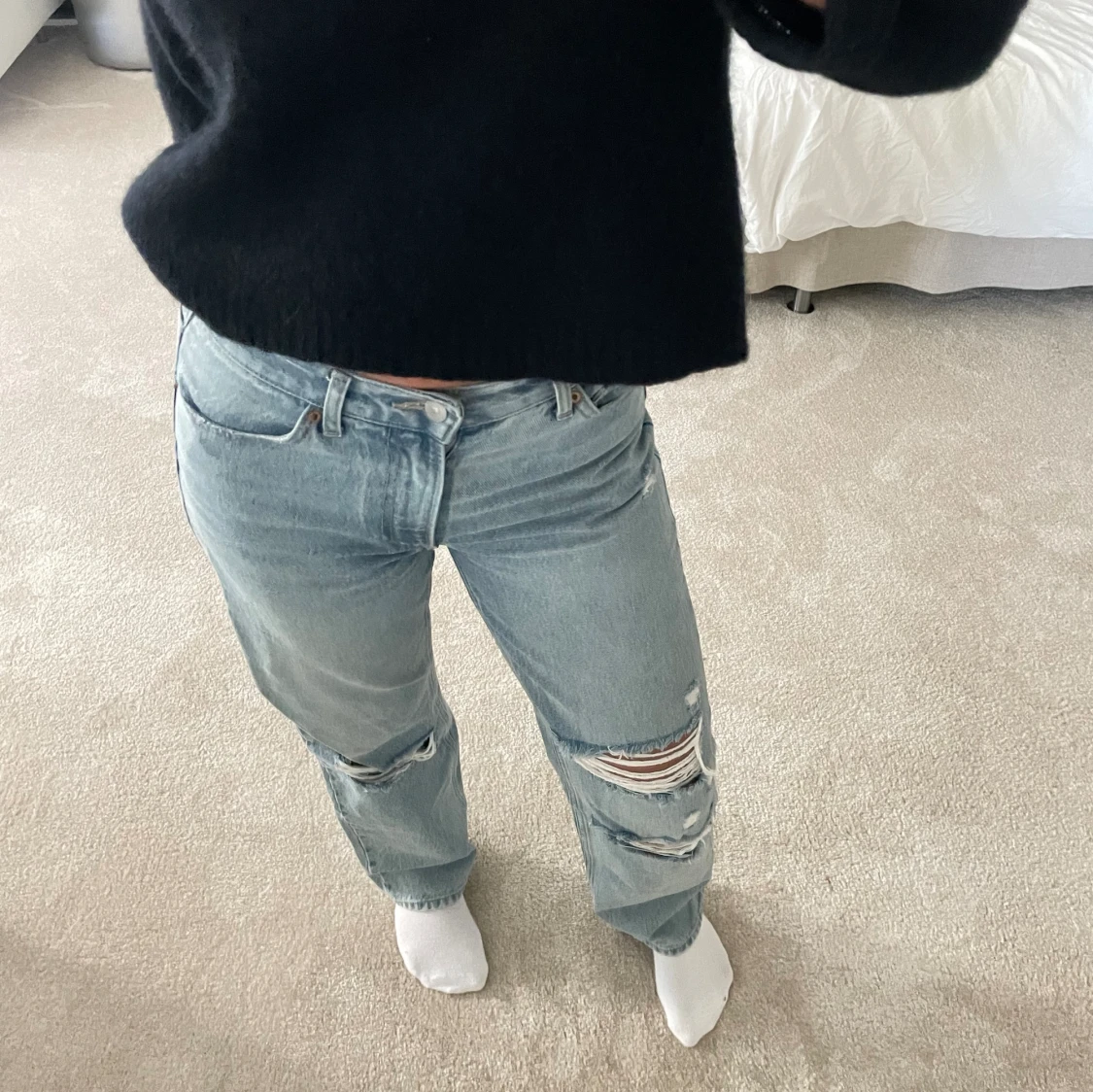 Jeans med slitningar 