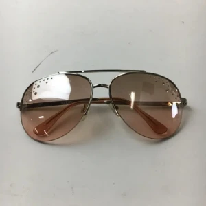 Solglasögon - Aldo. Aprikos. Glitterstenar.