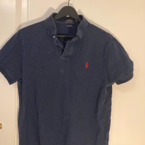 RALPH LAUREN POLO - Blue button shirt. Barely worn, In perfect condition. Selling because outgrew it. 