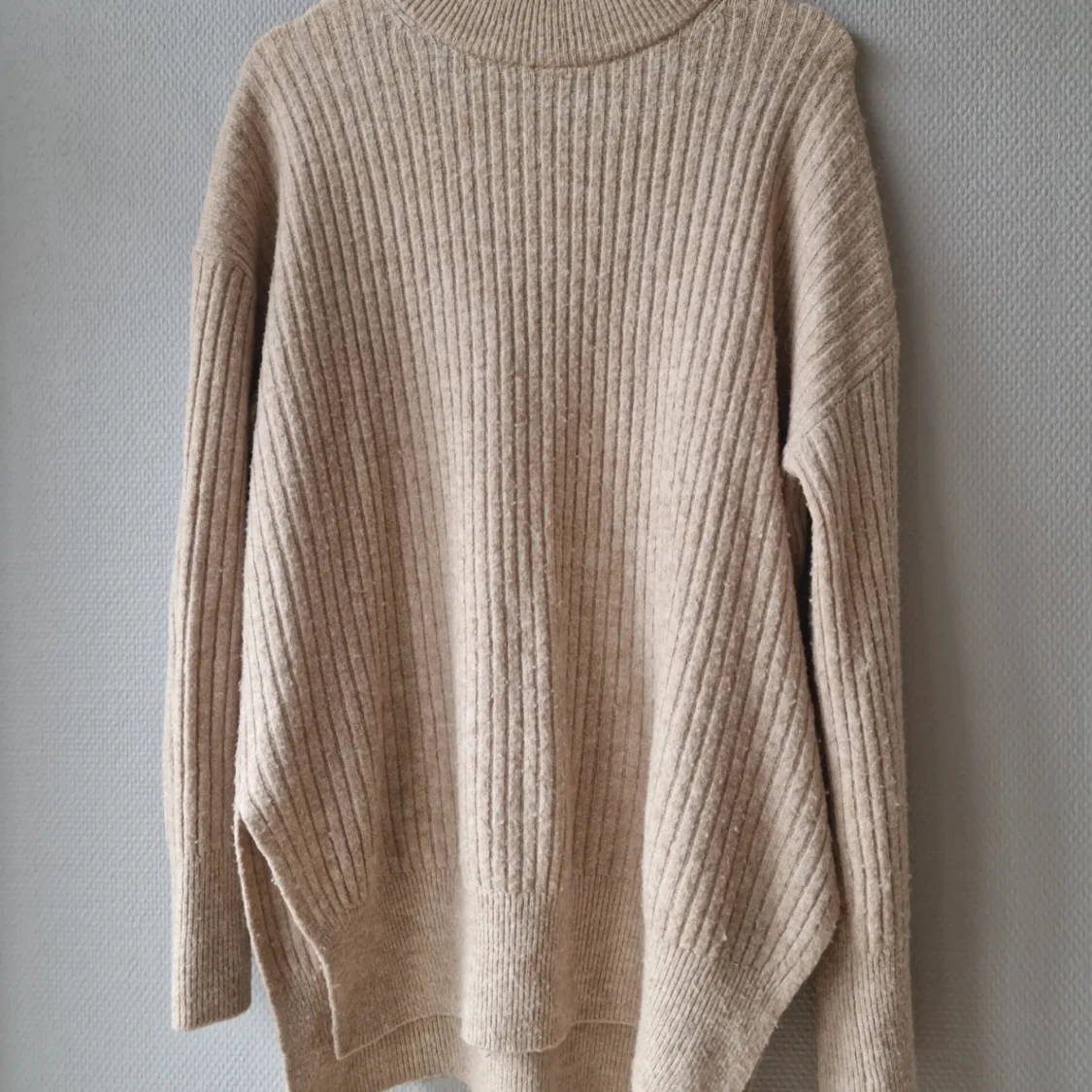 Stickad längre tröja 