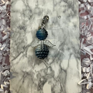 Svart och blå lyckoängel  - Svart och blå lyckoängel.