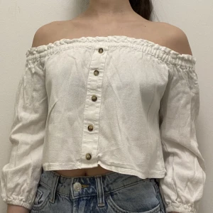 White off the shoulder long sleeved top  - A white long sleeved top (off shoulder). Sleeves don’t go fully to the wrist, just a bit above the wrist. Really good for spring and summer. I’m good condition (no rips)