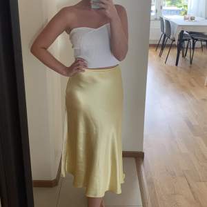 Yellow satin midi silk skirt from Zara 