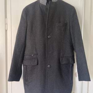 Classic wool Blend trench coat, designed by JERM BLACK.  Size:48 