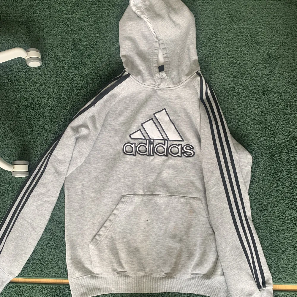 Adidas hoodie, has a small hole on the pocket and some paint stains (picture 2). Hoodies.
