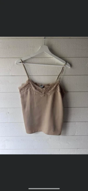 Spettslinne från Twist & Tango - Beige spettslinne från Twist & Tango