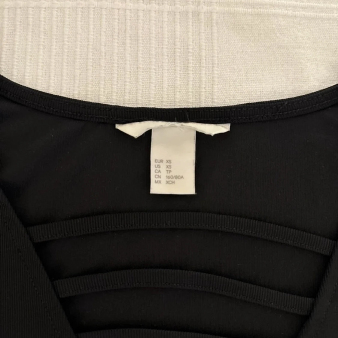 Topp med detaljer  - 91