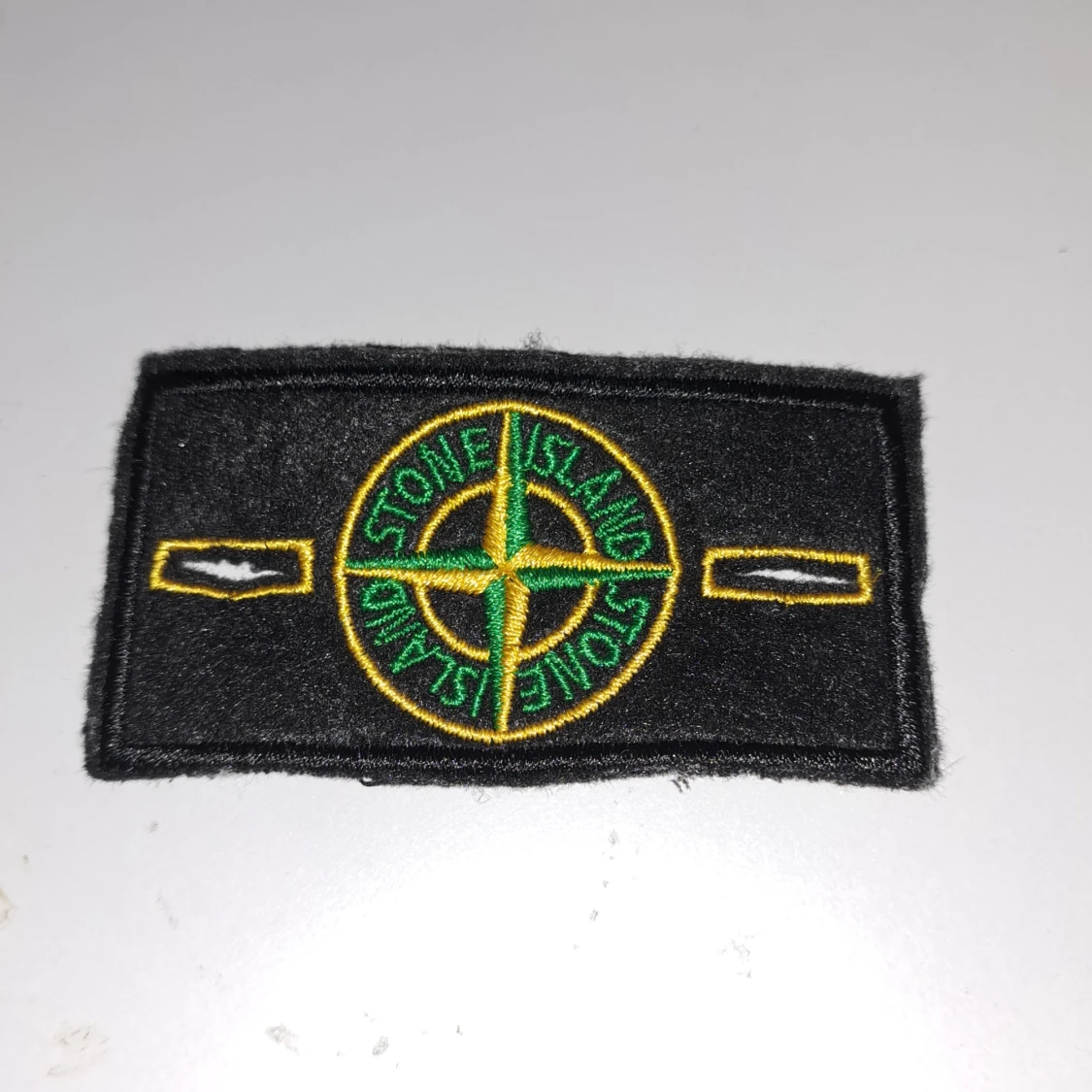 Stone island badge