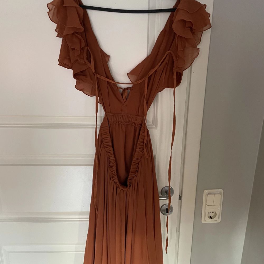 Brun Lång brun/orange klänning | Plick Second Hand