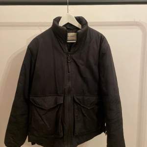 Warm Our Legacy black bomber jacket. Size M (48). Well used but in good condition. Has a tiny scratch from the zipper but doesn't show when upzipped:  Measurements: Length: 73 cm Shoulder width: 48 cm Sleeve length: 65 cm