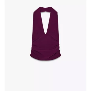  halterneck topp  - Säljer en vinröd/lila halterneck topp med  v-ringning och snygg drapering i sidorna. Toppen är ärmlös och har en croppad passform som ger en cool och trendig look. Toppen är bara använd en gång och är som ny. Nypris 229 kr. 175 kr 