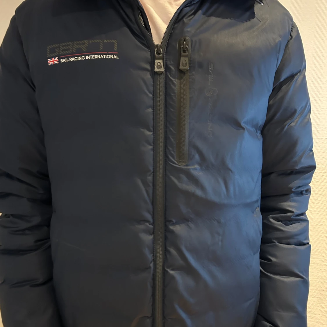 Marinblå Sail Racing dunjacka S